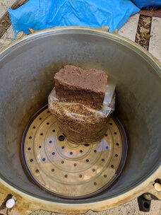 a brick used while stacking bags